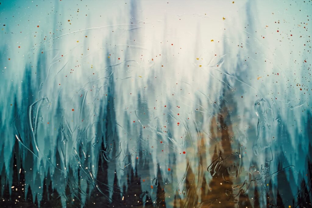 Abstract image with vertical blue and brown streaks, textured swirls, and scattered small colored dots evokes a sense of layered movement—reminiscent of water damage restoration in Garnet Valley PA, blending artistry with subtle restoration themes.